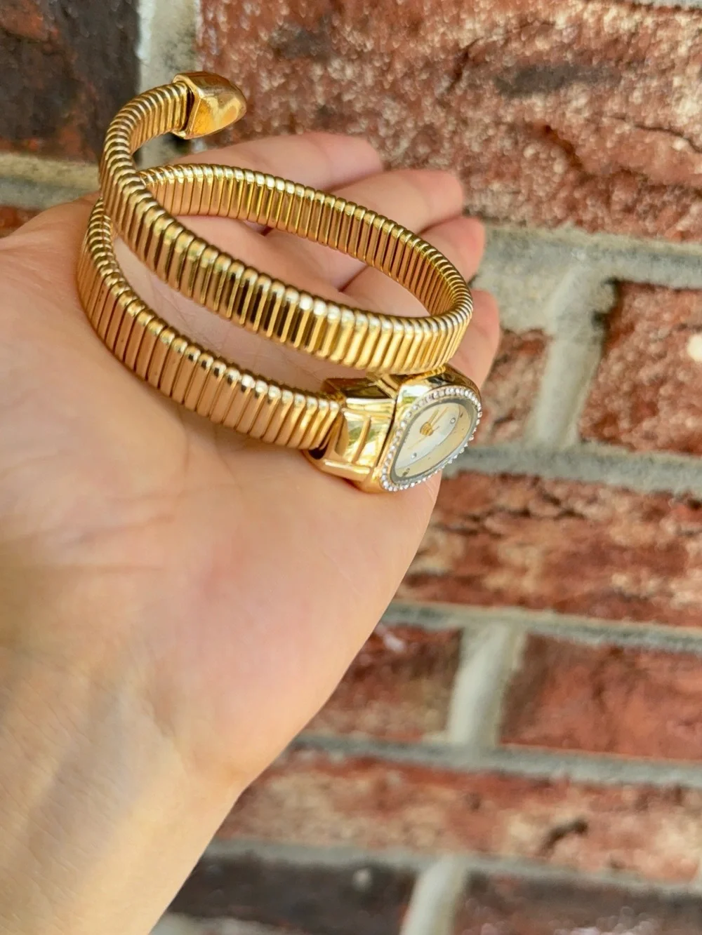 Gold serpentine bracelet watch